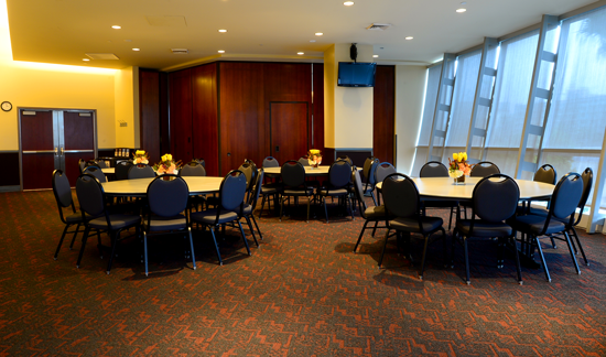 Tables and chairs set up in conference room